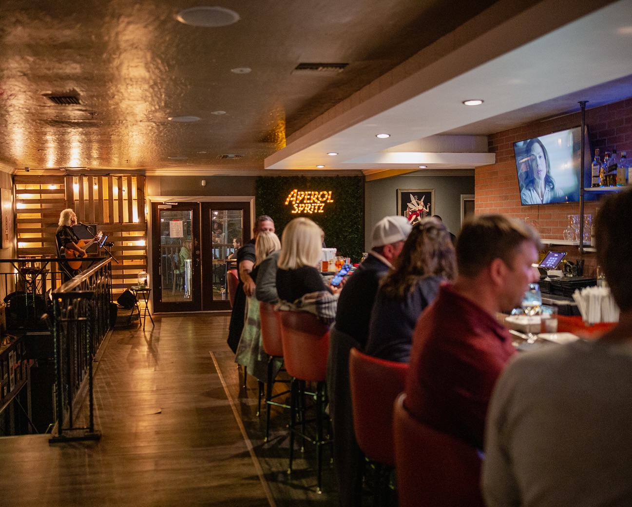 Photo of guests sitting at the bar in an Italian Restaurant in Tampa, Florida. Trattoria Pasquale